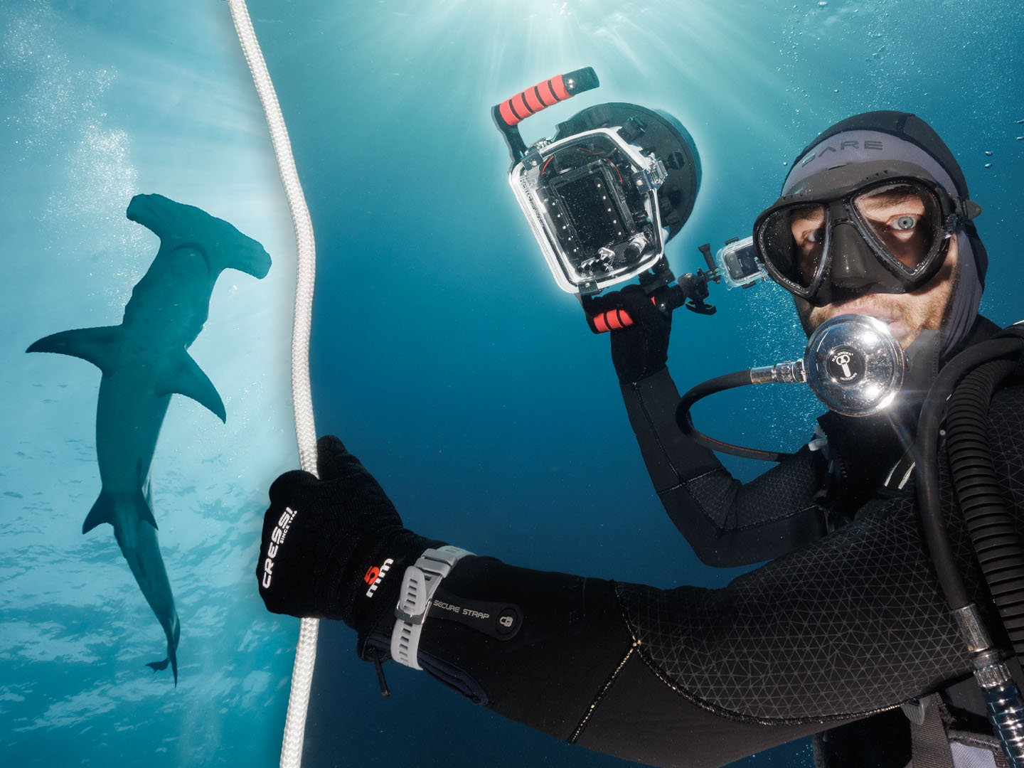 Nikon ZR Underwater Review with Ikelite 200DL Underwater Housing, image features Video Producer Logan Wood and a hammerhead shark.